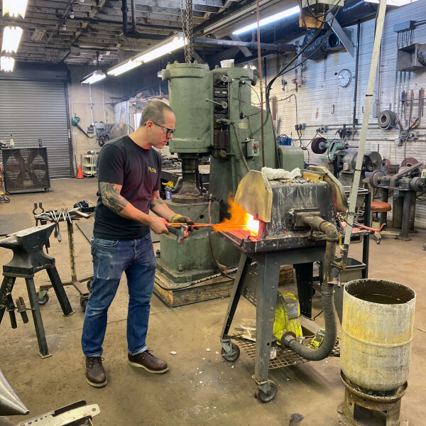 bladesmith Eytan Zias forging a knife
